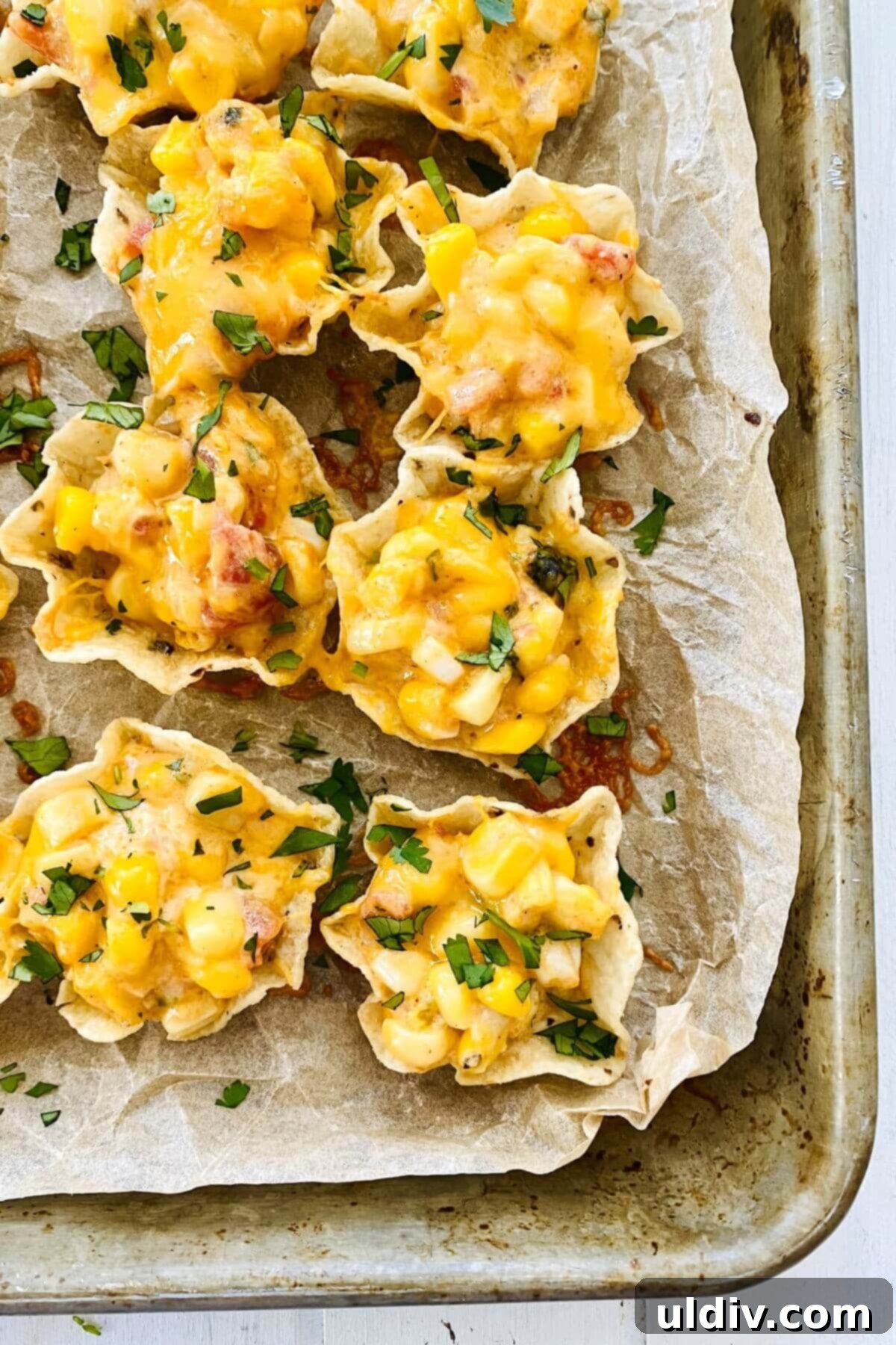 Baked Cheesy Corn Delight 3 Tostito Scoops filled with hot corn dip.