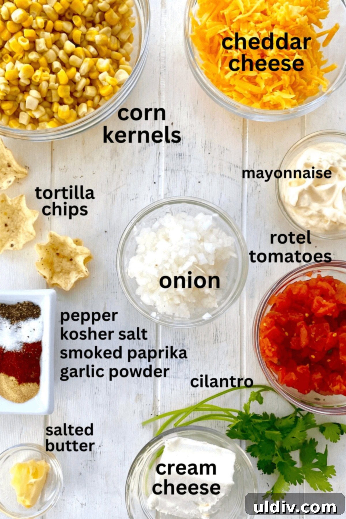 Baked Cheesy Corn Delight 4 corn, cheese, onion, mayo, spices, cilantro, tomatoes.