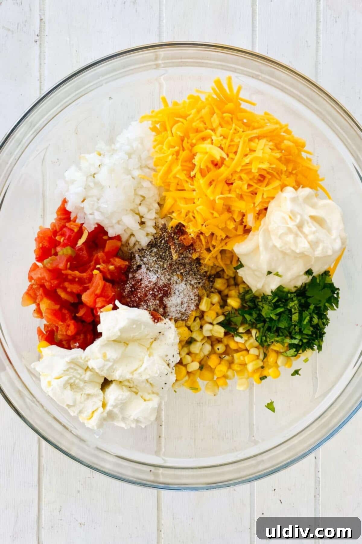 Baked Cheesy Corn Delight 6 corn, onion, cilantro, mayo in a bowl.