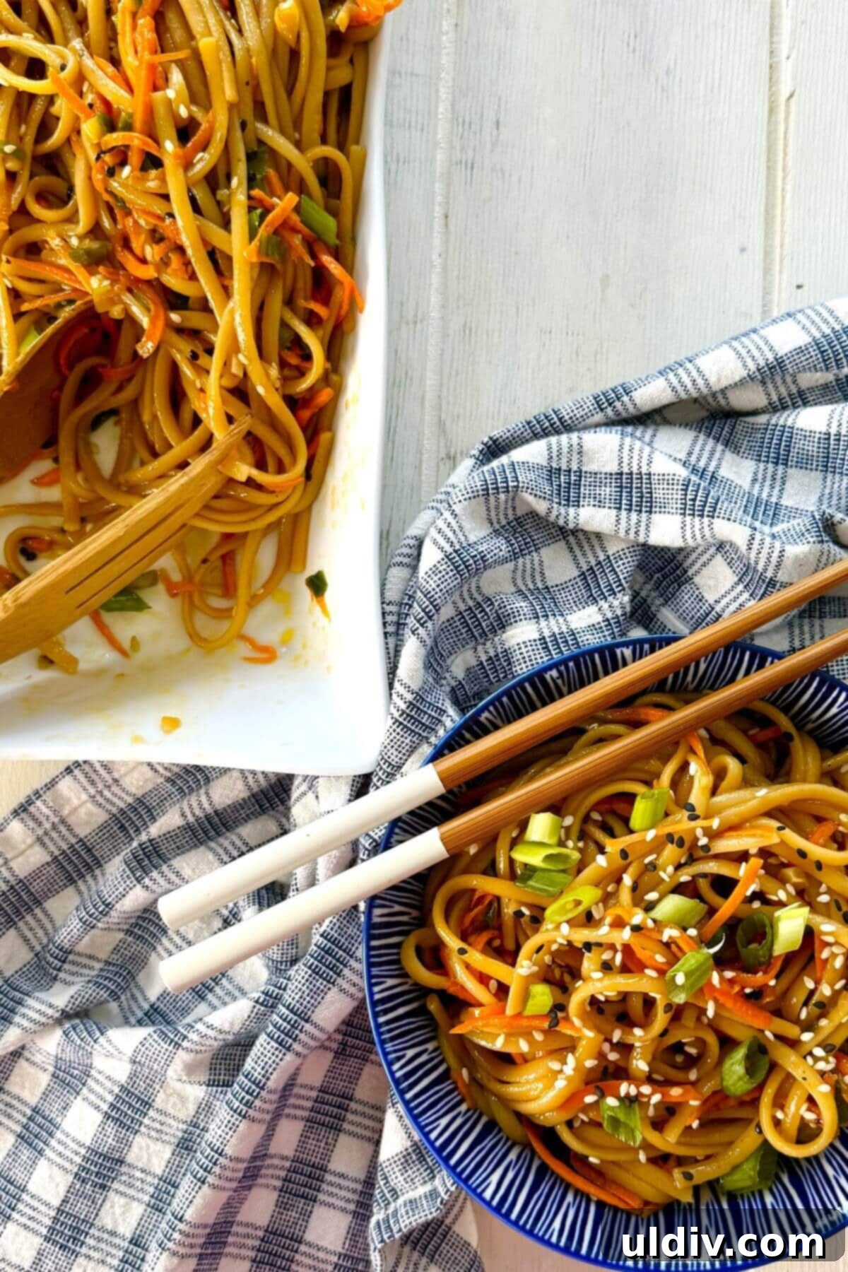 Effortless One-Pot Garlic Sesame Noodles 11 A bowl of sesame noodles, beautifully presented with a cloth napkin beside it.