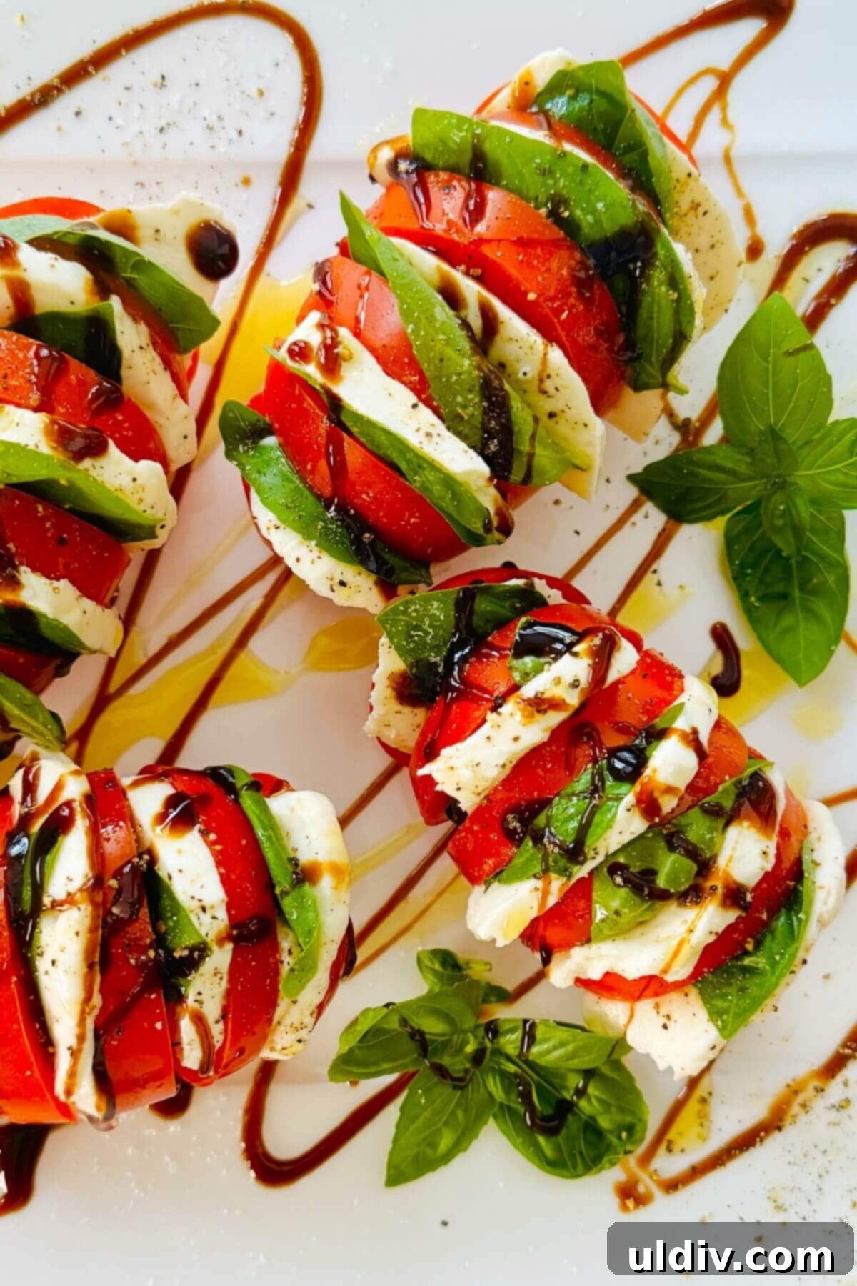 Caprese Stuffed Tomatoes 2 tomatoes stuffed with mozzarella and basil.