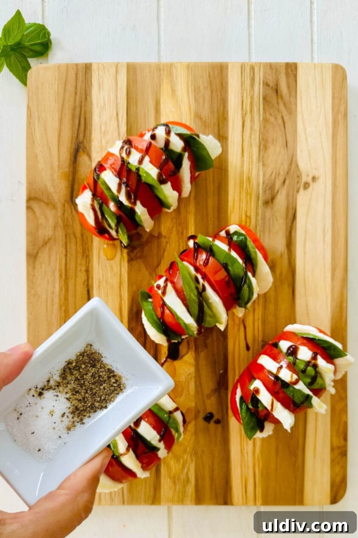 Caprese Stuffed Tomatoes 7 salt and pepper with caprese salad tomatoes.