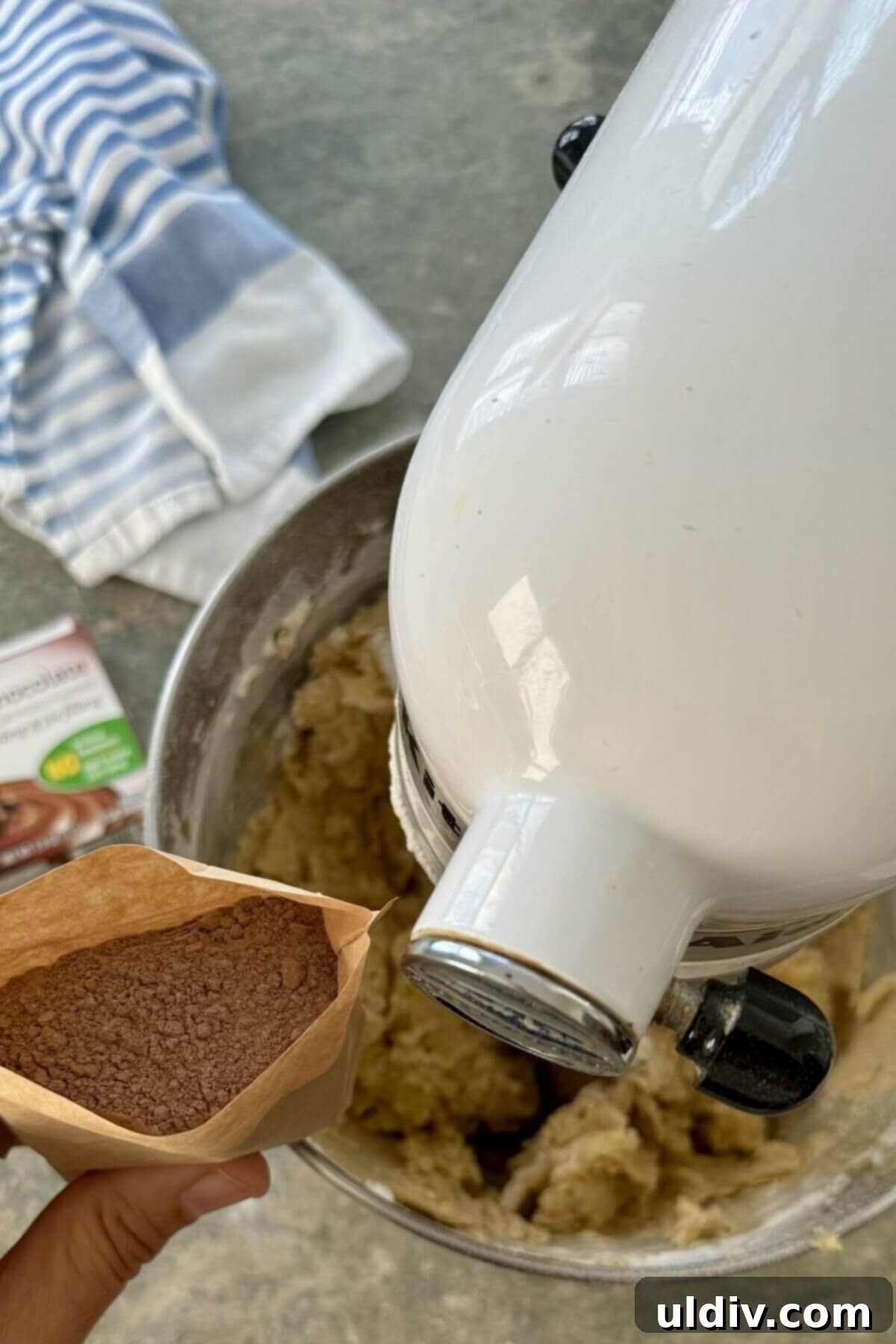 Double Chocolate Pudding Cookies 7 Adding instant chocolate pudding mix to the wet cookie batter in a stand mixer.