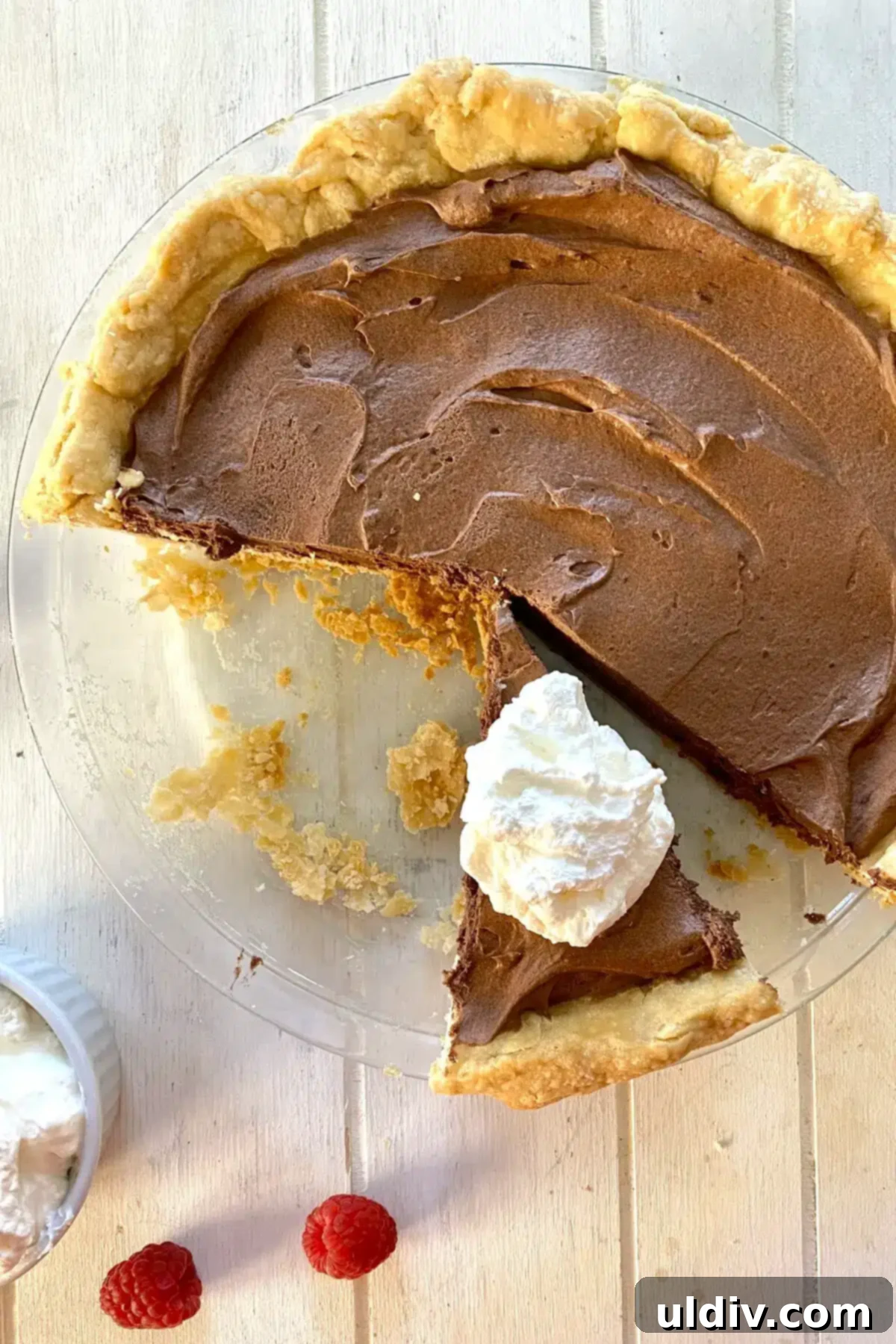 The Ultimate French Silk Pie Recipe Surpassing Bakers Square 12 French silk pie with slice with shipped cream.