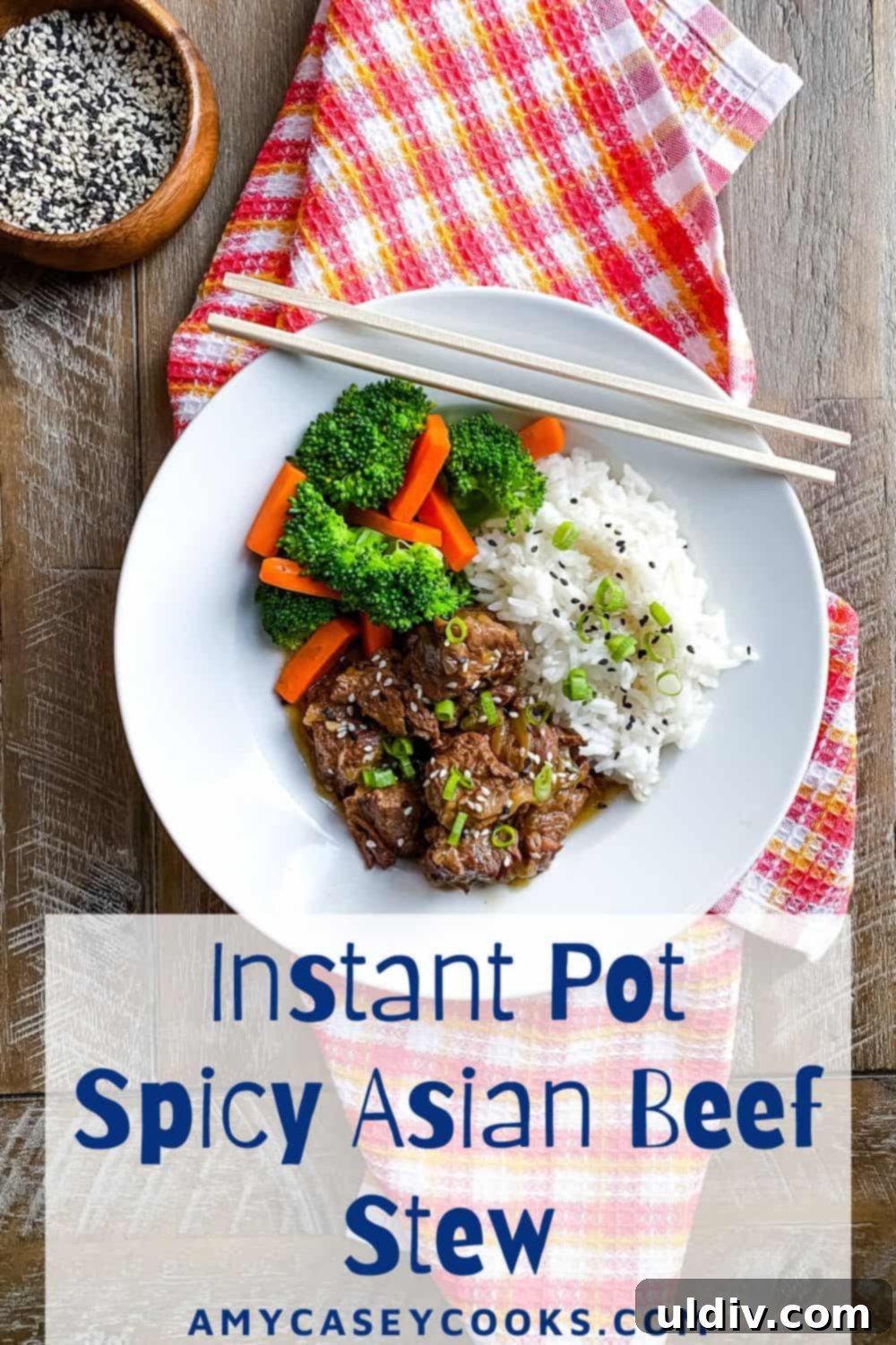 beef stew with Asian spices with rice, broccoli, carrots and chopsticks