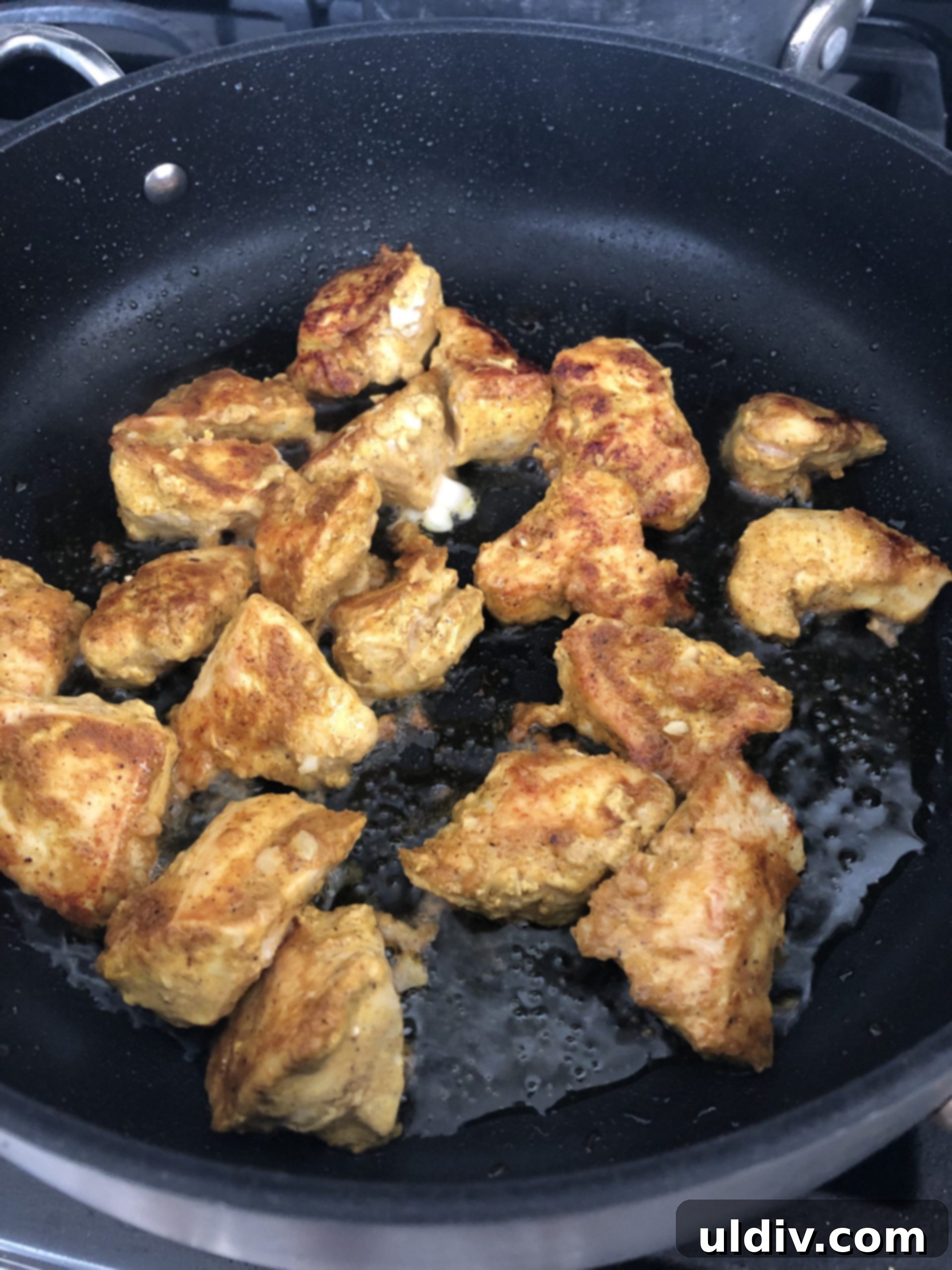 Velvety Butter Chicken with Fluffy Naan 4 Sauteing chicken cubes in a pan.