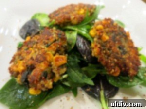 Super Bowl's Plant-Based Play: Quinoa, Sweetcorn, and Spinach Patties 2 Delicious and healthy homemade quinoa patties, golden brown and ready to serve.