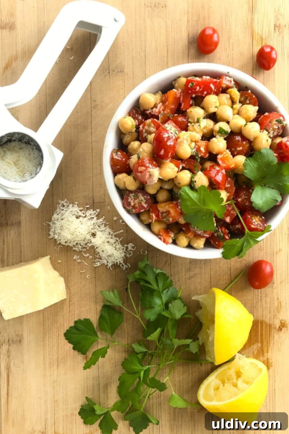 Mediterranean Chickpea Tomato Salad with Zesty Herb Dressing 4 cheese grater with chickpea salad.