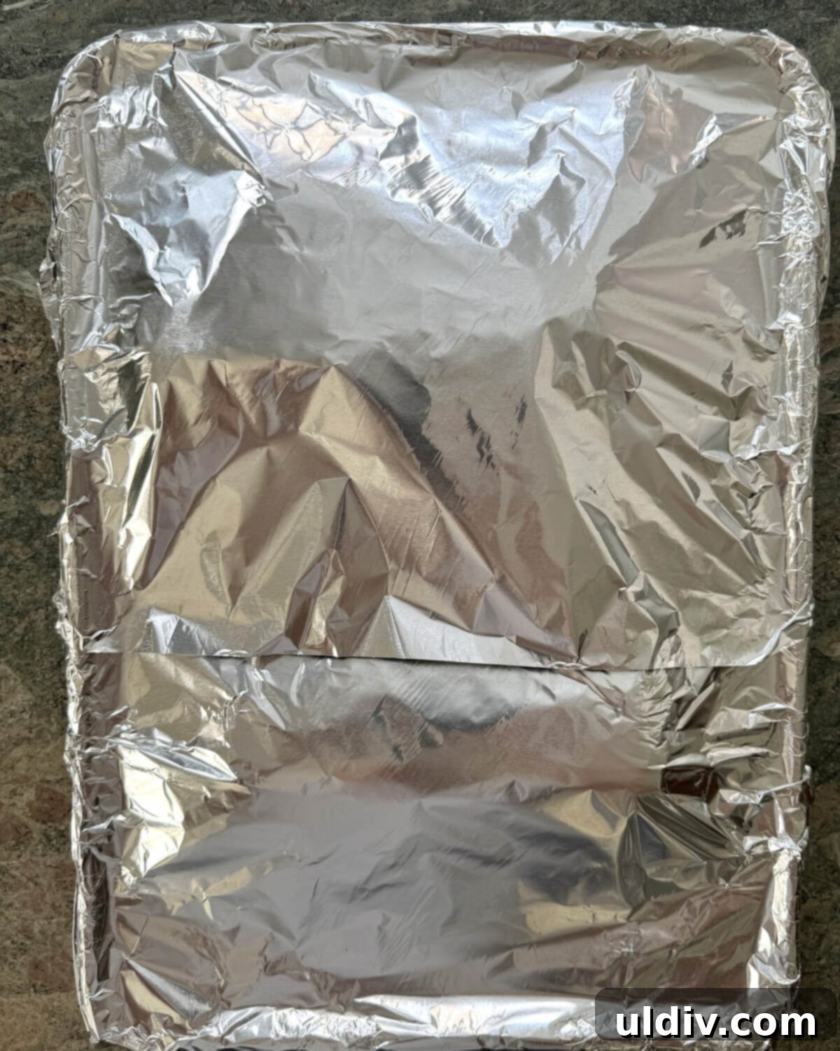 Meltingly Tender Baked Baby Back Ribs 7 Foil covered baking sheet.
