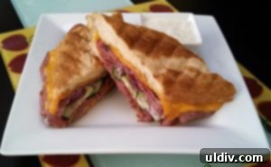 Pastrami Panini: Crafted from Your Fridge Finds 2 Delicious Pastrami Panini, golden brown and ready to be enjoyed.