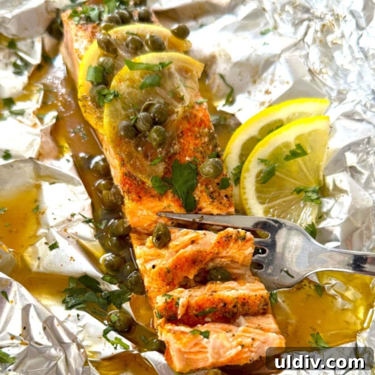 A salmon fillet baked in a foil packet, showcasing its perfectly flaky texture.