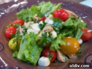 Enhancing culinary creations with premium EVOO A vibrant summer salad glistening with extra virgin olive oil