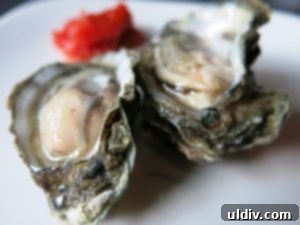 Devon Seafood Grills New Oyster Bar: A Regal National Oyster Day Indulgence 2 Freshly shucked oysters on ice at a seafood restaurant