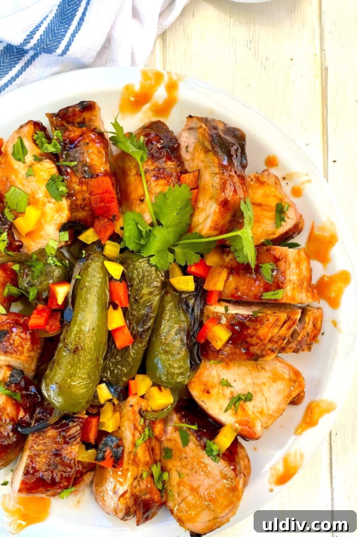 Sweet Heat Pork Tenderloin 3 glazed pork tenderloin with grilled jalapeno peppers.