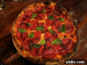 Osteria La Madia Review: A Pasta Love Affair That Will Leave You Begging For Seconds 10 Freshly baked triple pepperoni pizza with a drizzle of truffle oil