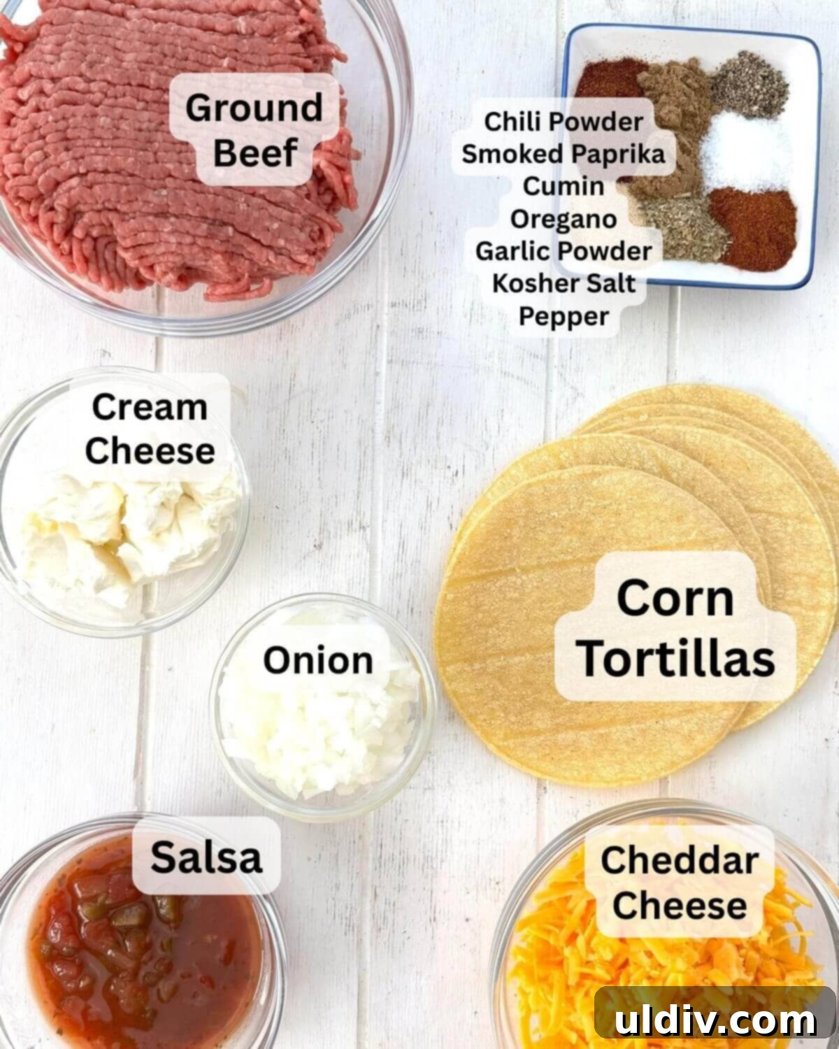 Crunchy Baked Taquitos 3 Ground beef, tortillas, a selection of spices, diced onion, cream cheese, shredded cheddar, and a bowl of salsa displayed on a wooden board.