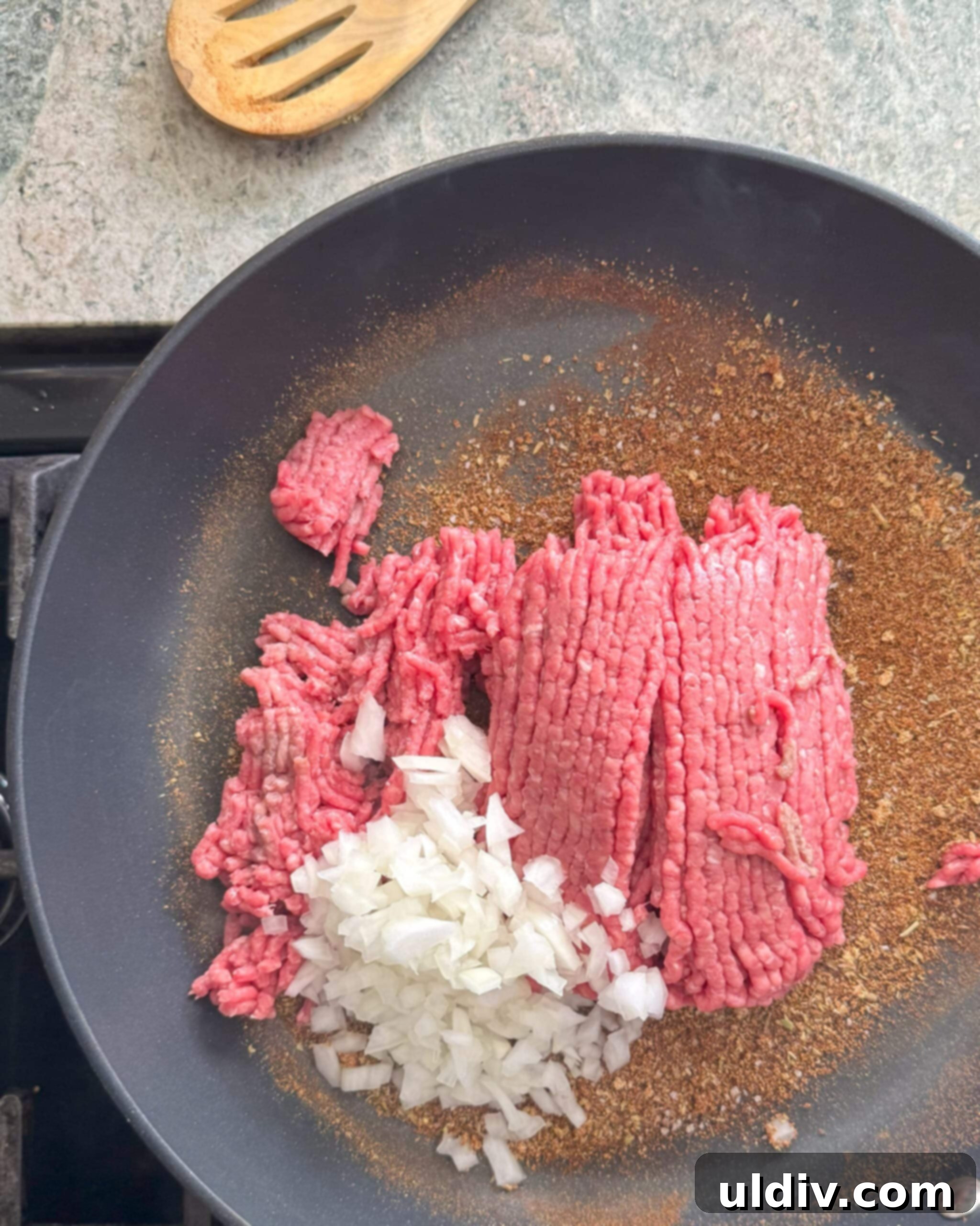 Crispy Baked Taquitos 4 Ground beef, diced onion, and a blend of Mexican spices cooking in a sauté pan.