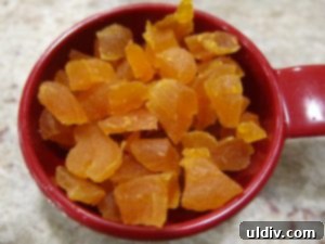 Post-Christmas Leftover Rescue: Cocoa Fruit Balls 3 Cubed dried apricots and whole dried cranberries in a bowl