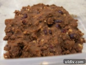 Post-Christmas Leftover Rescue: Cocoa Fruit Balls 5 Mixing the ingredients for cocoa and fruit balls to a homogeneous texture
