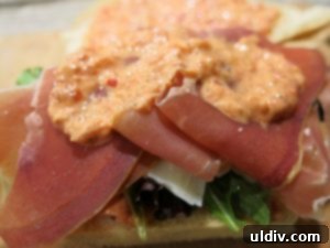 Mediterranean Sunshine Panino: Manchego & Jamón Serrano 7 A small amount of roast red pepper dip spread over the Jamón Serrano layer