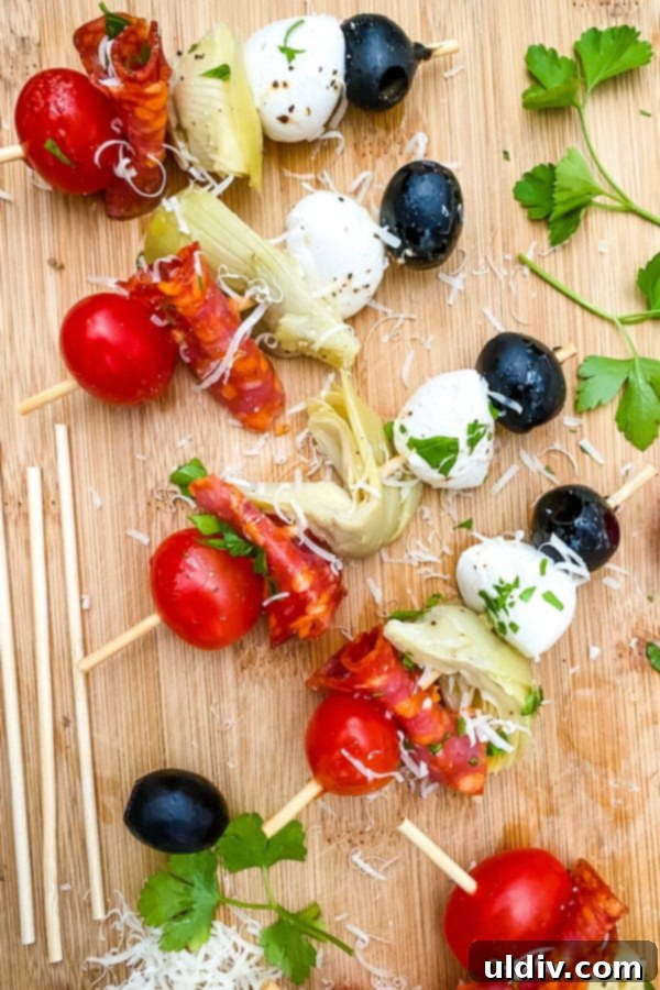 No-Fuss Antipasto Picks 2 Close-up of vibrant Antipasto Skewers featuring fresh mozzarella, cherry tomatoes, salami, artichoke hearts, and black olives.