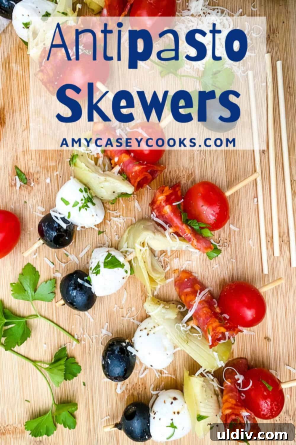 No-Fuss Antipasto Picks 7 Antipasto skewers featuring olives, fresh mozzarella, salami, and artichoke hearts artfully arranged on a serving board.