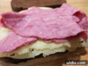 Emerald Feast: My St. Patrick's Day Sandwich 8 First layer of corned beef on Swiss cheese