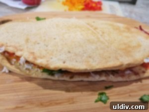 The Naan Sandwich: Decadence, Flavor, and Modern Craze 11 Warm Naan Sandwich Cut in Half, Served with Red Pepper Dip