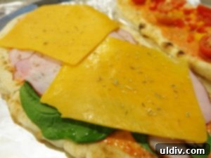 The Naan Sandwich: Decadence, Flavor, and Modern Craze 5 Naan Topped with Spinach, Canadian Bacon, and Cheddar Cheese