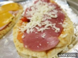 The Naan Sandwich: Decadence, Flavor, and Modern Craze 8 Naan Sandwiches Baking in the Oven with Melting Oaxaca Cheese