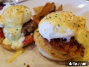 Maggiano’s savory meatball Benedict (back) and rich crab cake Benedict (front) on a plate