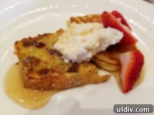 Maggiano's Brunch: Transforming Life's Lemons into Lemon Ricotta Pancake Perfection 10 A close-up of dessert heaven: Lemon ricotta pancakes and French toast adorned with whipped cream, maple syrup, and fresh strawberries