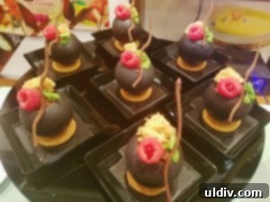 The Future of Chocolate Forged at US Masters 8 Chocolate eggs filled with raspberry mousse and sponge cake, on Linzer cookies