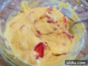 Sweetest Mom, Sweetest Treat: Decadent Mango Crepes for Mother's Day 11 Sliced strawberries being mixed into mango and condensed milk filling