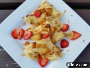 Sweetest Mom, Sweetest Treat: Decadent Mango Crepes for Mother's Day 15 Finished mango crepes with warm fudge topping and cinnamon