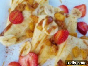Sweetest Mom, Sweetest Treat: Decadent Mango Crepes for Mother's Day 16 Close-up of Mother's Day mango crepes, ready to be enjoyed