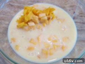Sweetest Mom, Sweetest Treat: Decadent Mango Crepes for Mother's Day 6 Chopped Ataulfo mangoes and sweetened condensed milk in a bowl