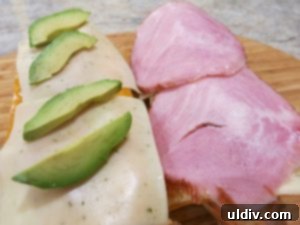 Easy Breezy Cheesy Veggie Sandwich With a Goat Cheese Zing 11 Polish ham placed on top of cucumber slices on the sandwich half