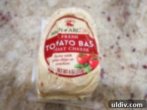 Easy Breezy Cheesy Veggie Sandwich With a Goat Cheese Zing 3 Tomato and basil goat cheese, a premium selection for an elevated sandwich