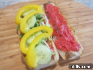 Memorial Day Sausage Sandwich Sizzle Not Your Average Pigs in a Blanket 11 Lettuce, cucumber, and bell pepper on a sandwich roll