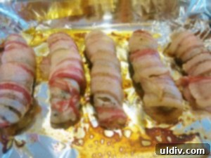 Memorial Day Sausage Sandwich Sizzle Not Your Average Pigs in a Blanket 7 Bacon-wrapped sausages out of the oven, ready for cheese