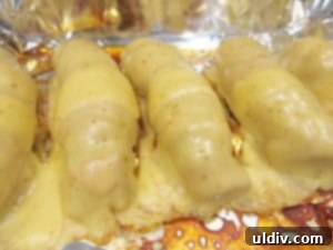 Memorial Day Sausage Sandwich Sizzle Not Your Average Pigs in a Blanket 9 Melted cheese sausages, ready for sandwich assembly