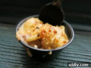 Mac & Cheese Smackdown: Decoding Deliciousness 2 A tantalizing close-up of a golden-brown mac and cheese dish, promising culinary delight.