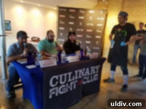 Culinary Fight Club Blended Burger Challenge: Fierce Flavors, Noble Cause 11 Chef Won Kim presenting his burger