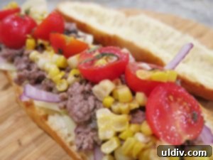 Tomato and sweet corn salad layered on top of the meat and mushroom mixture