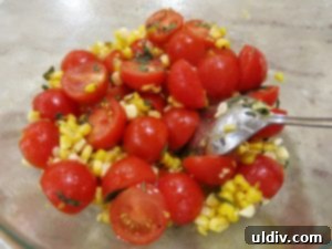 Freshly cut corn kernels, cherry tomatoes, and oregano for the salad