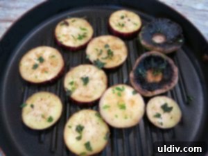 When life gives you eggplants, elevate them into an irresistible sweet pepper panino. 6 Grilling eggplant slices and mushroom caps on a nonstick pan