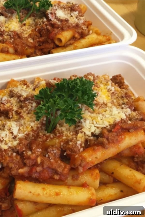 Simple Pancetta Bolognese 2 An inviting plate of easy bolognese sauce served over perfectly cooked pasta, garnished with fresh herbs, ready to enjoy.