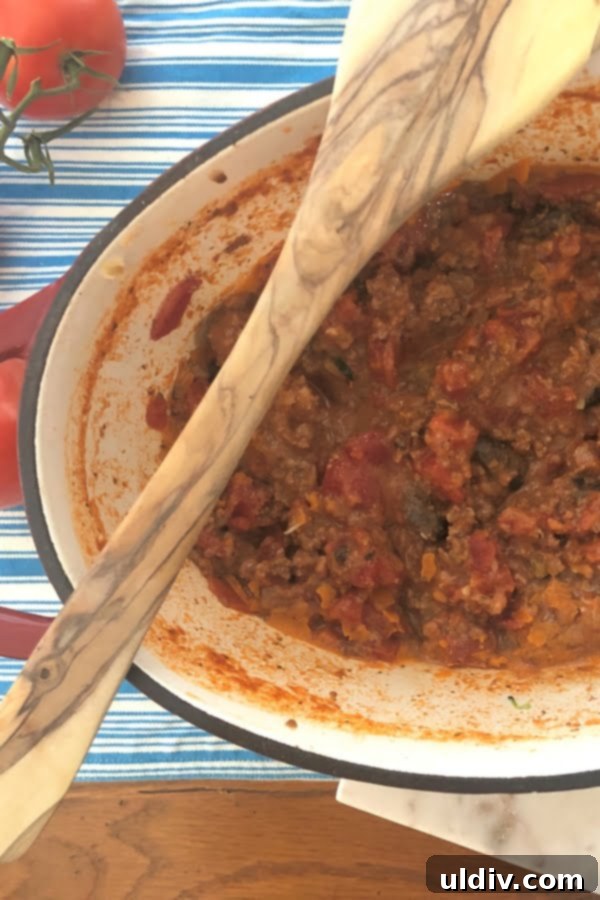 Effortless Pancetta Bolognese 4 A large pot filled with rich, homemade bolognese sauce, ready to be served or stored.