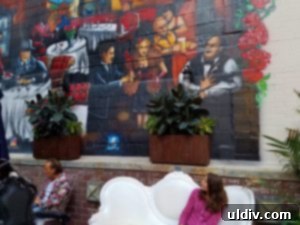 Friend Marina admiring vibrant murals at Gino's East Chicago